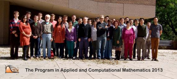 group of 30 people standing in front of building